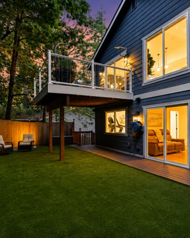 Lakeside home surrounded by autumn foliage in the Pacific Northwest